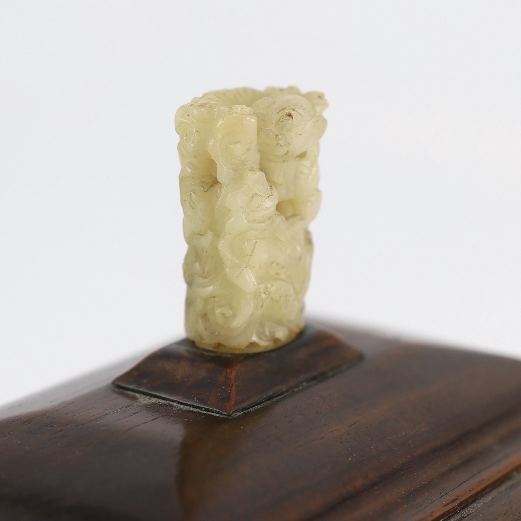 An early 20th century Chinese hongmu stand and cover with a 17th/18th century pale white jade finial